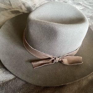 100% wool grey hat with accent ribbon. Adjustable. Never worn. Brand new.